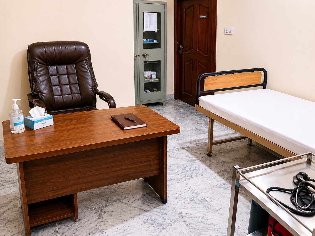 A private consultation and assessment room at IRADA's Islamabad clinic, with a desk and a hospital bed.